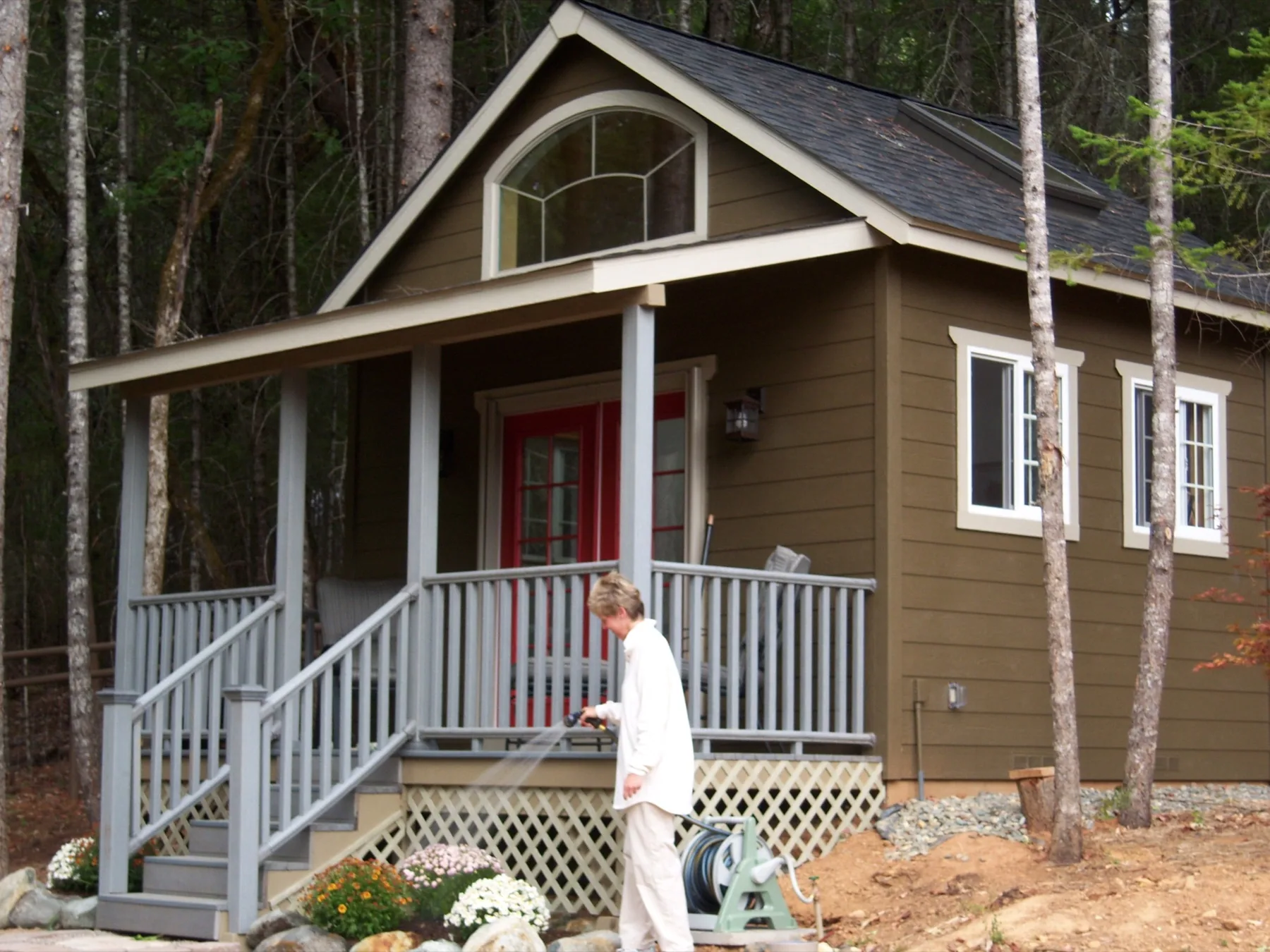 Finished tiny home with a covered porch