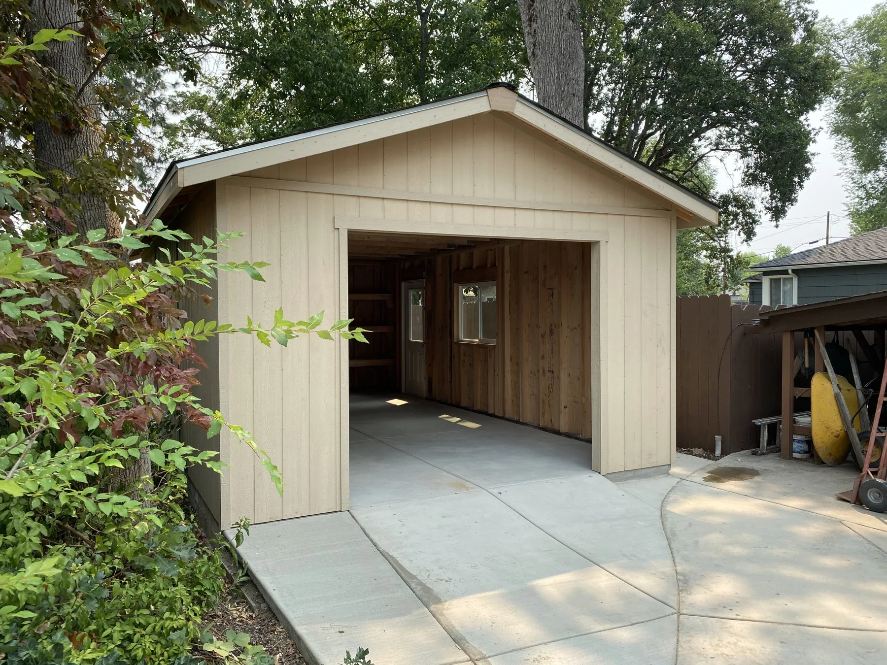 Garage built on a finished concrete slab and driveway
